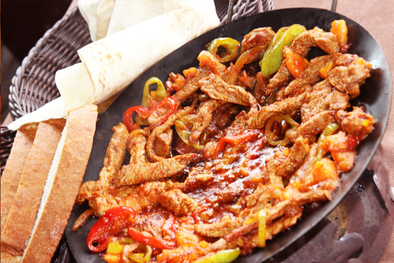Chicken and grilled dishes at Antioch Restaurant Budva